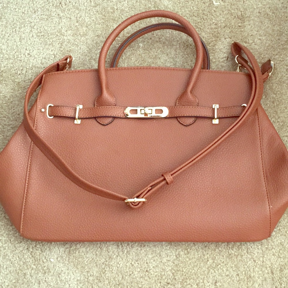 Brown tote bag with gold buckles. Never used.